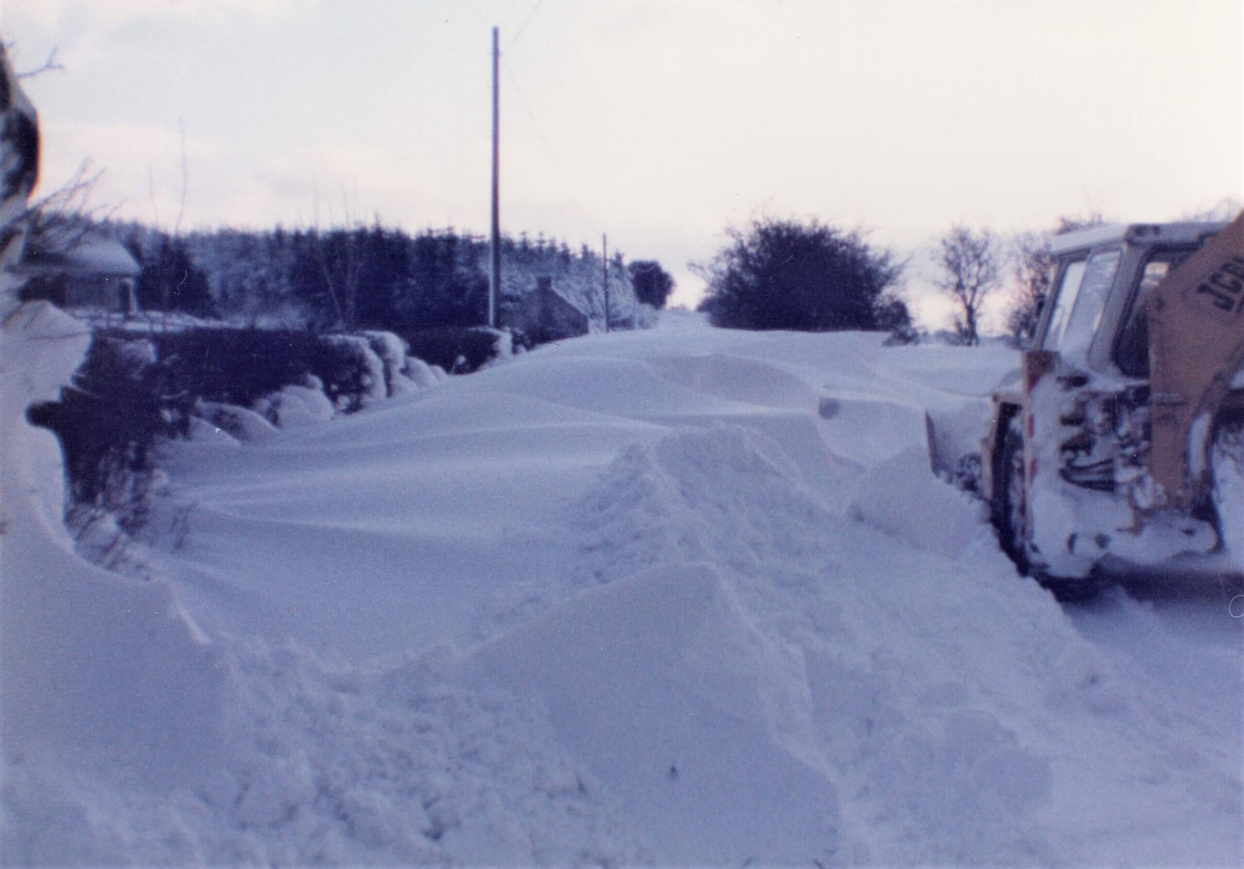 Snow being cleared from road beside The Hollow, Glenshesk, 1970's. Photo - Niall McCaughan
