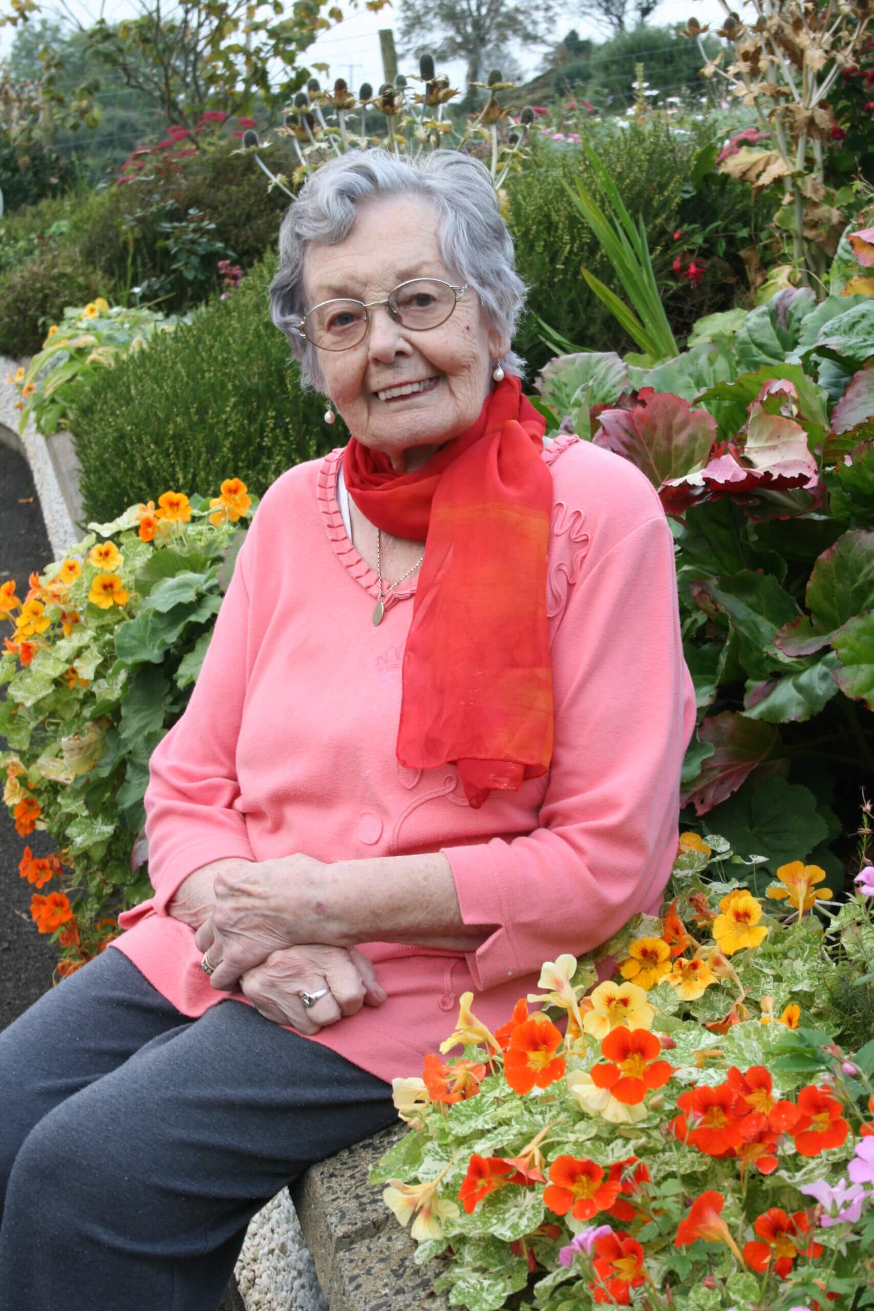 Betty McCaughan in her garden, Uaigh, Glenshesk