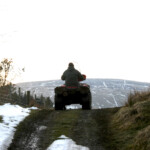 Heading home on the Quad, with Knocklayde Mountain in the background, Glenshesk. Photo - Niall MCaughan Heading home on the Quad, with Knocklayde Mountain in the background, Glenshesk. Photo - Niall MCaughan